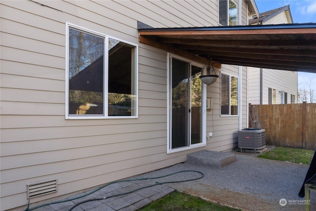 view of property exterior with a patio area and central air condition unit