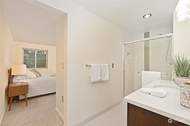 bathroom with walk in shower and vanity