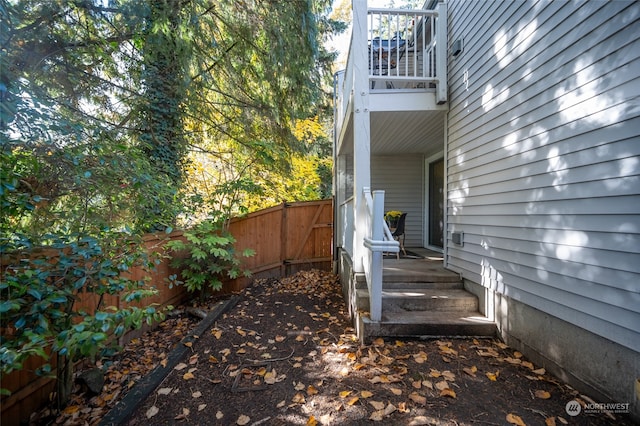 view of yard featuring a balcony