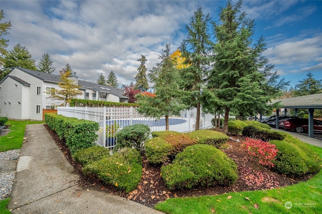 exterior space with a carport