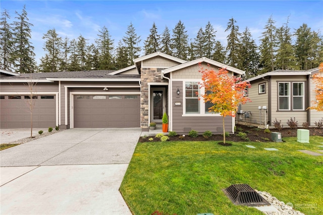 view of front of property with a front lawn and a garage