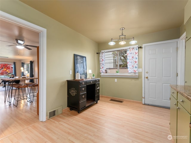 dining area featuring light hardwood / wood-style floors and ceiling fan