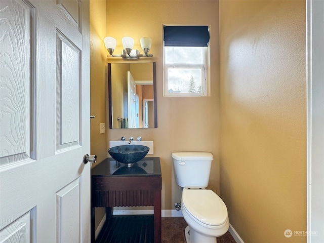 bathroom with toilet and vanity