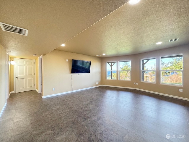 unfurnished living room featuring a textured ceiling