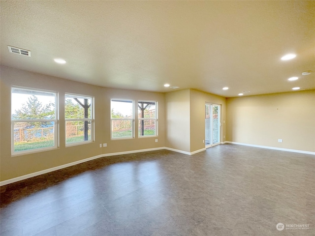 empty room with a textured ceiling