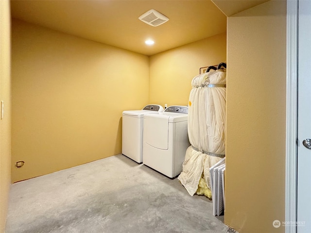 clothes washing area featuring washing machine and dryer