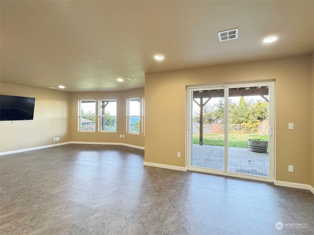 unfurnished living room with a textured ceiling