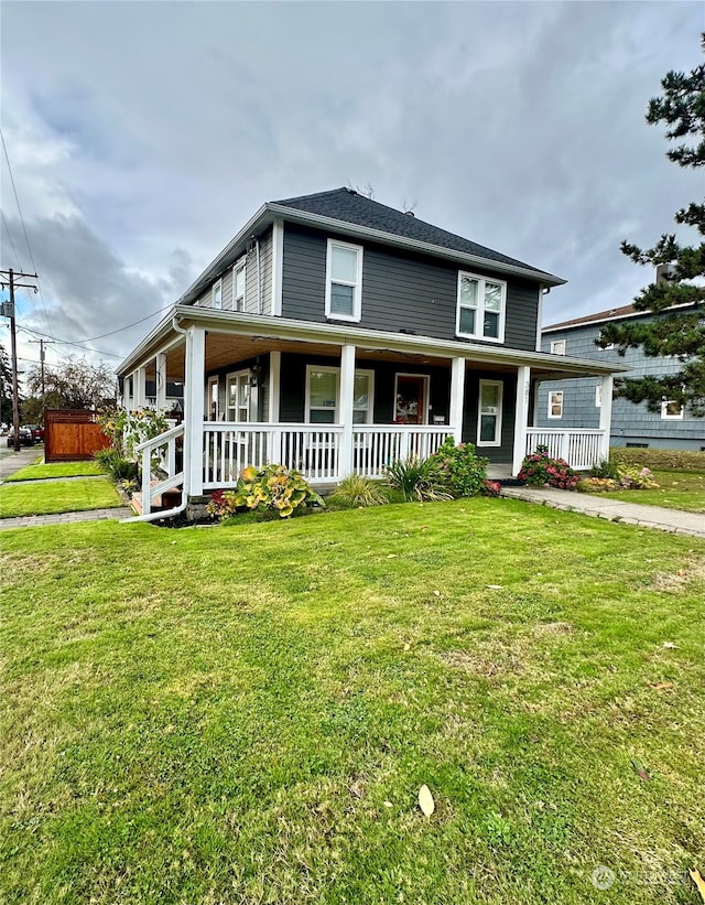 farmhouse inspired home with a porch and a front yard