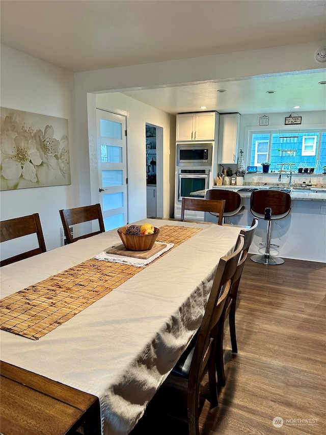 dining area with dark wood-type flooring