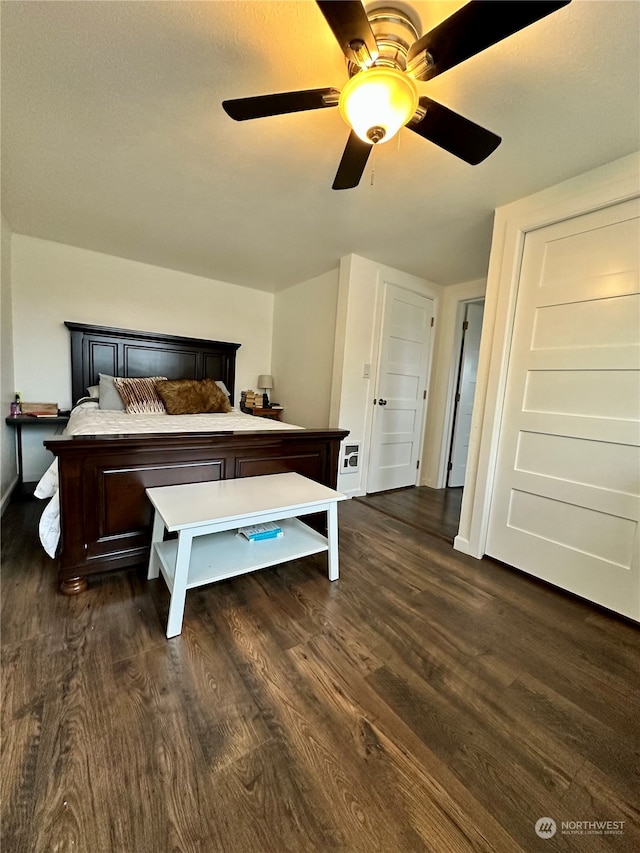 bedroom featuring dark wood-type flooring and ceiling fan