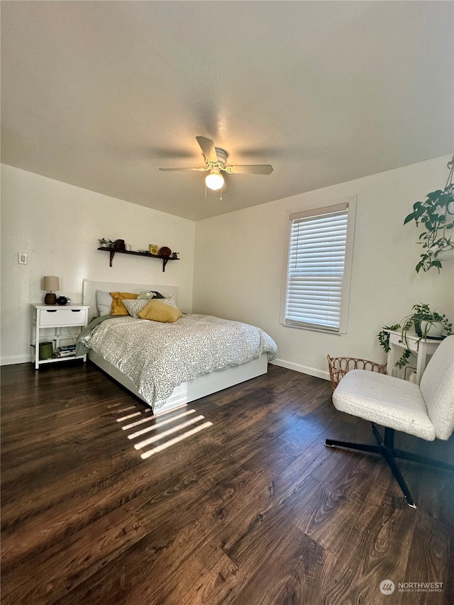 bedroom with dark wood-type flooring and ceiling fan