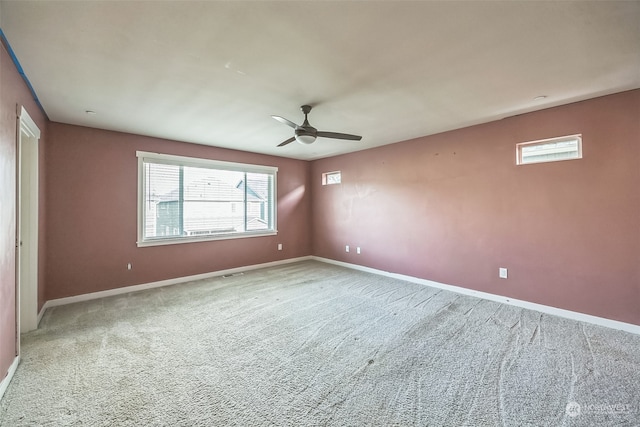 spare room with carpet and ceiling fan