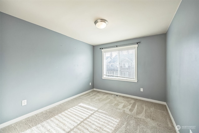 empty room with carpet flooring