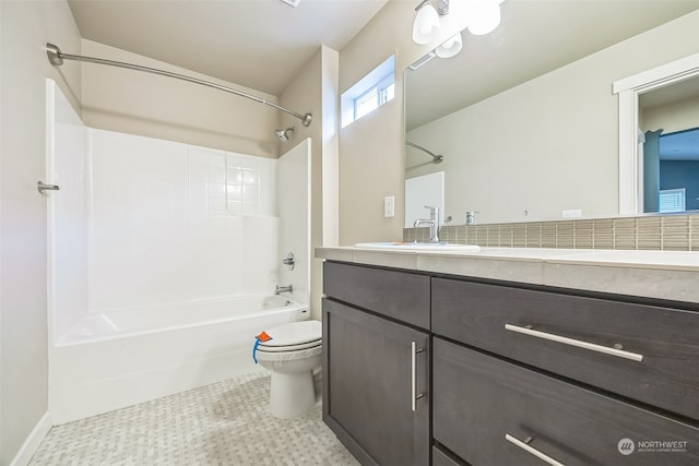 full bathroom featuring toilet, vanity, and bathing tub / shower combination