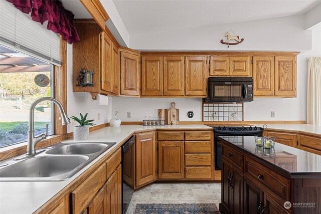 288 Torrence Ln, Oak Harbor, WA 98277 - kitchen with black appliances, brown cabinetry, and light countertops