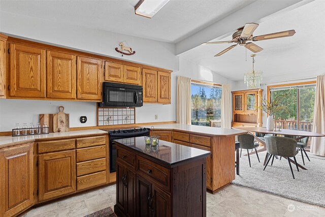 kitchen with lofted ceiling with beams, a center island, black appliances, and ceiling fan with notable chandelier