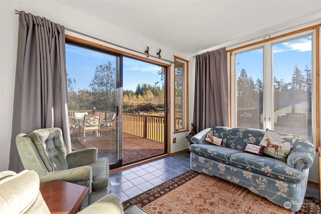 living room with tile patterned floors and plenty of natural light