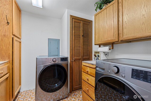 laundry area with electric panel, cabinets, and independent washer and dryer