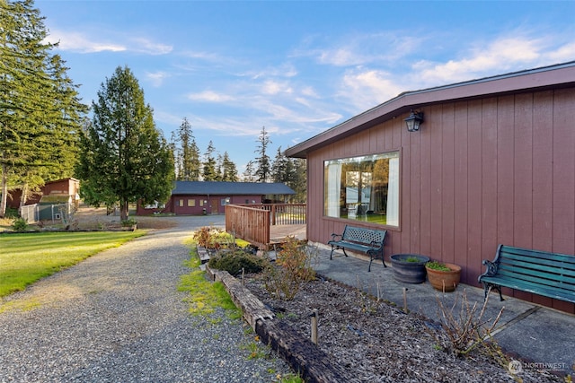 view of side of property with a wooden deck