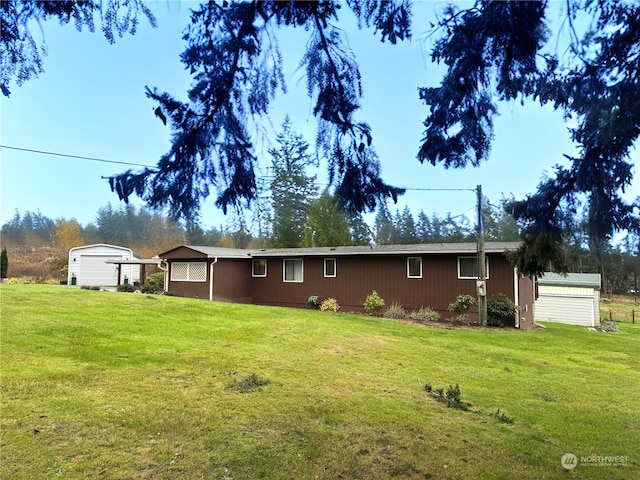 288 Torrence Ln, Oak Harbor, WA 98277 - view of side of property with a yard and an outbuilding