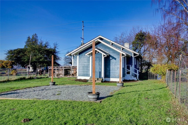 rear view of house with a lawn