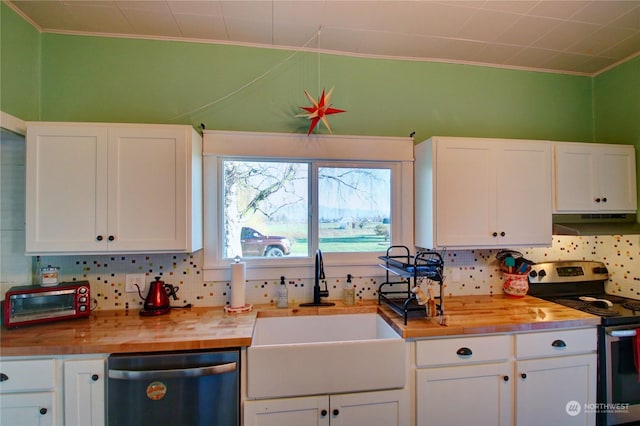 kitchen featuring white cabinetry, sink, and appliances with stainless steel finishes