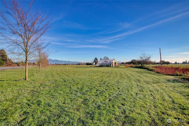 view of yard with a rural view