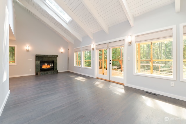 unfurnished living room with a fireplace, dark hardwood / wood-style flooring, high vaulted ceiling, beamed ceiling, and a skylight