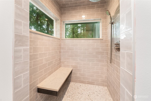 bathroom with tiled shower