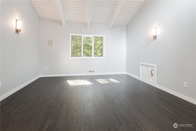 spare room with dark wood-type flooring, wood ceiling, and vaulted ceiling with beams