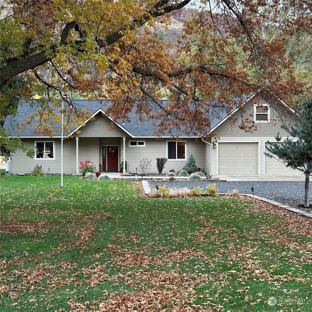 view of front of house featuring a garage and a front yard