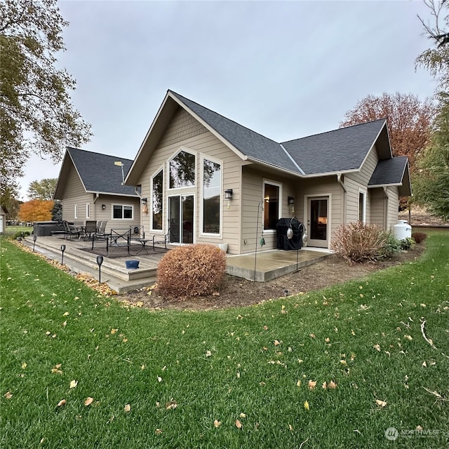 back of property featuring a yard and a patio