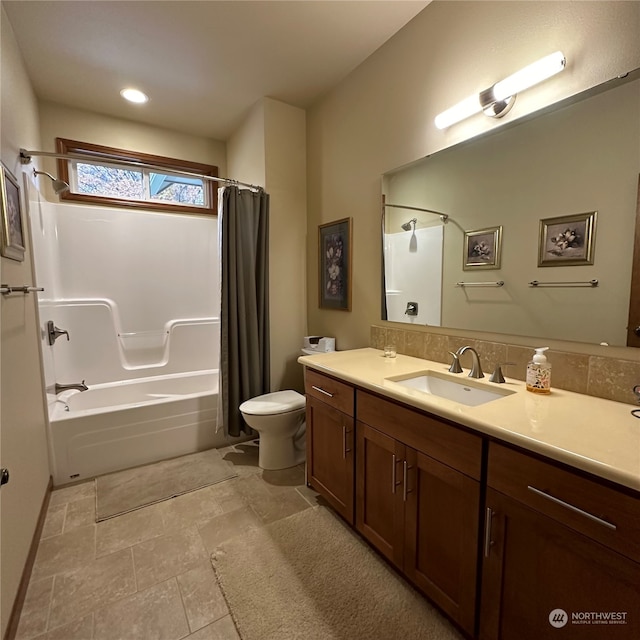 full bathroom with shower / bath combo with shower curtain, vanity, and toilet