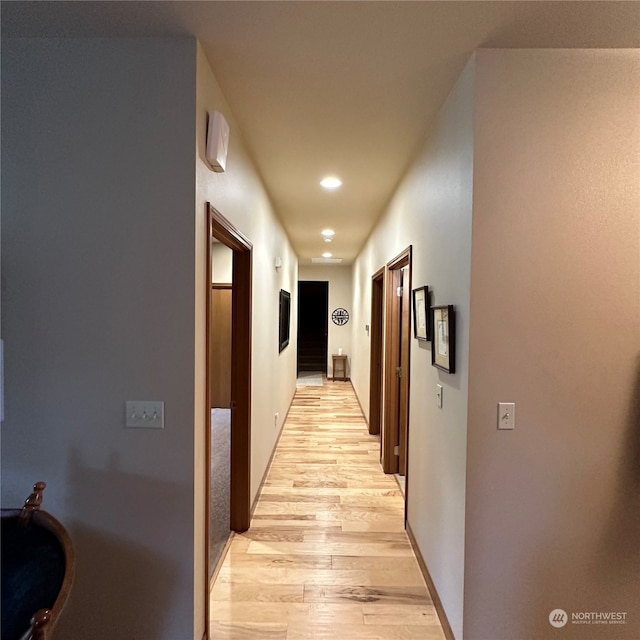 hallway featuring light wood-type flooring