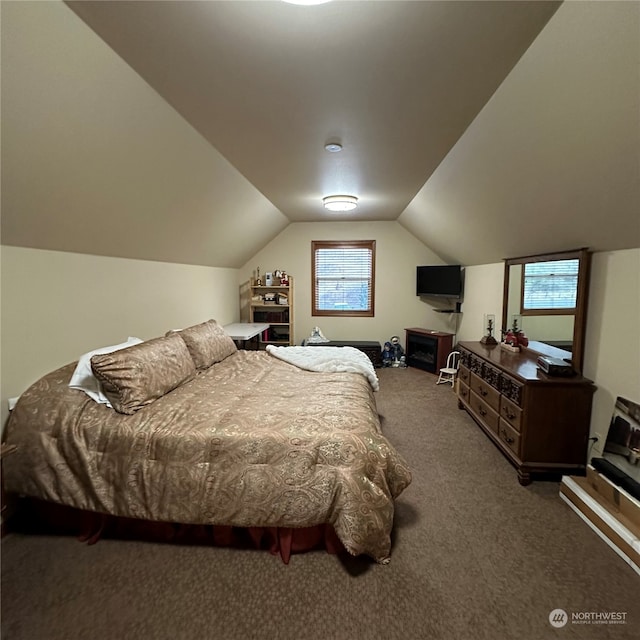 carpeted bedroom with vaulted ceiling