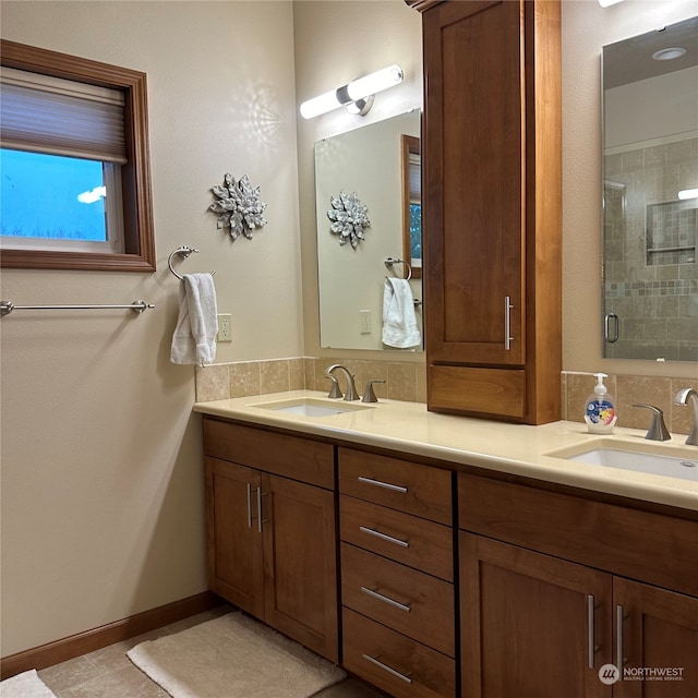 bathroom with tile patterned floors, vanity, and a shower with shower door