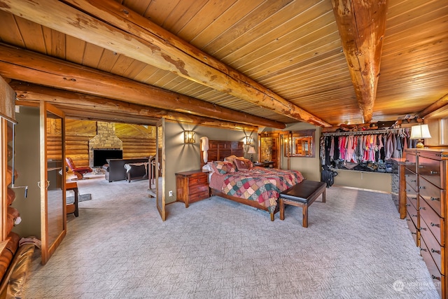 bedroom featuring a fireplace, beamed ceiling, wood ceiling, and log walls