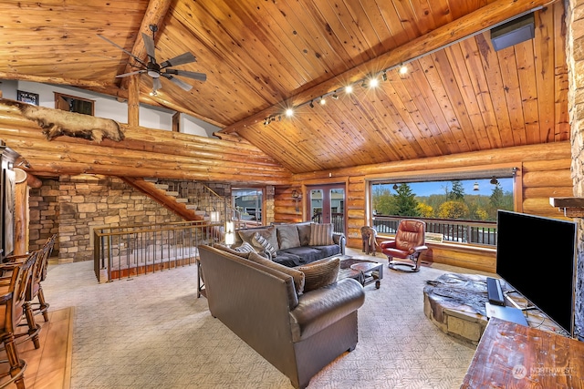 living room with wooden ceiling, beamed ceiling, track lighting, high vaulted ceiling, and log walls