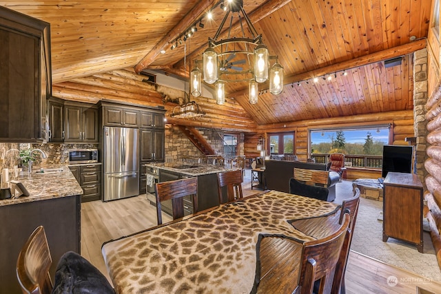 dining space with vaulted ceiling with beams, wooden ceiling, light hardwood / wood-style floors, and log walls