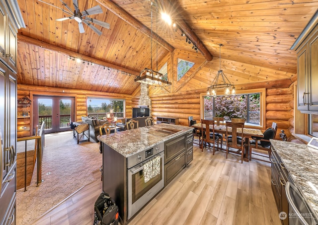 kitchen featuring hanging light fixtures, wooden ceiling, and light hardwood / wood-style flooring