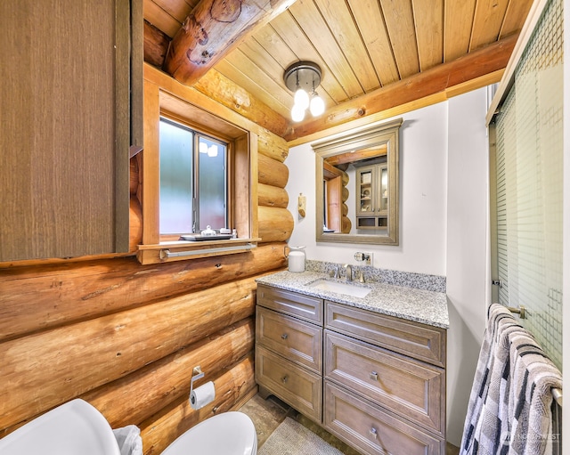 bathroom featuring toilet, wooden ceiling, vanity, beam ceiling, and log walls