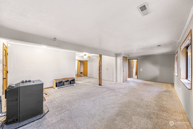 living room featuring carpet, a textured ceiling, and ceiling fan