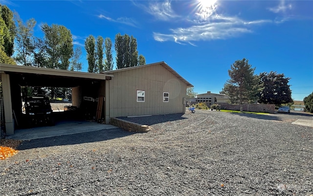 view of side of property with a carport