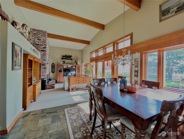 dining space featuring beam ceiling, high vaulted ceiling, and a chandelier