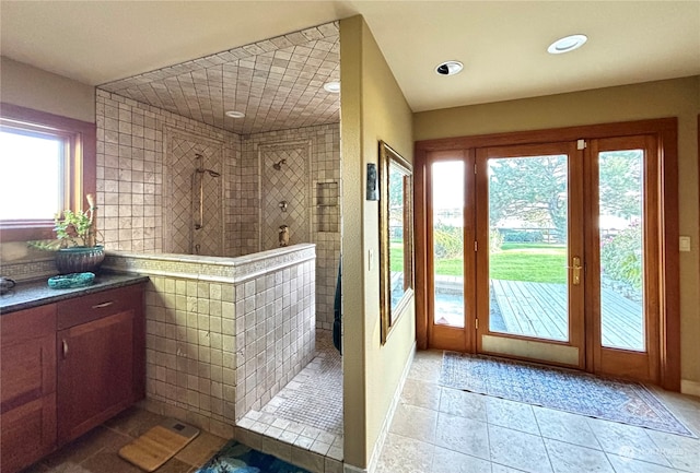 doorway with a healthy amount of sunlight and light tile patterned floors