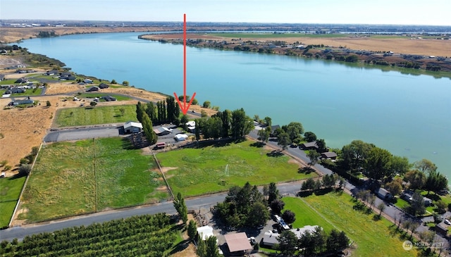 birds eye view of property featuring a water view