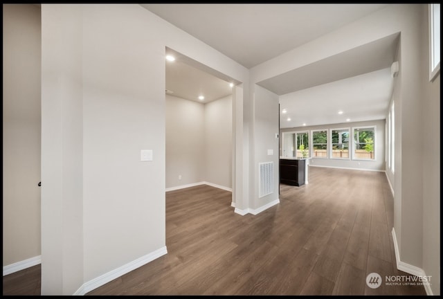 corridor featuring dark hardwood / wood-style flooring