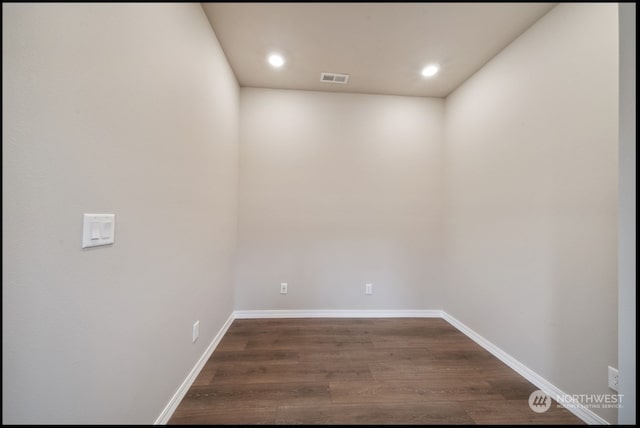 spare room with dark hardwood / wood-style flooring