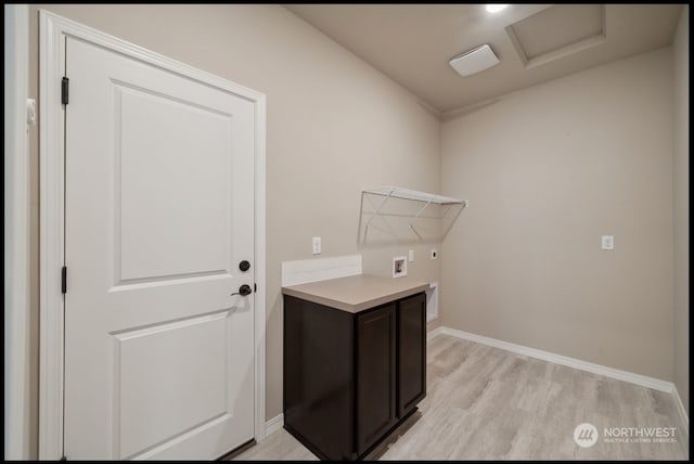 laundry area featuring hookup for a washing machine, light hardwood / wood-style flooring, and electric dryer hookup