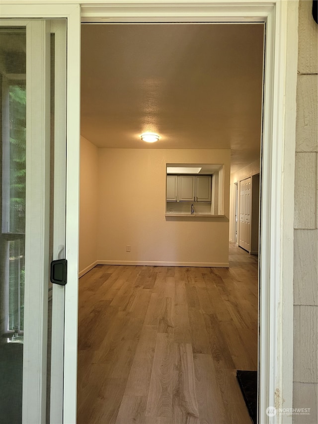 corridor featuring hardwood / wood-style flooring